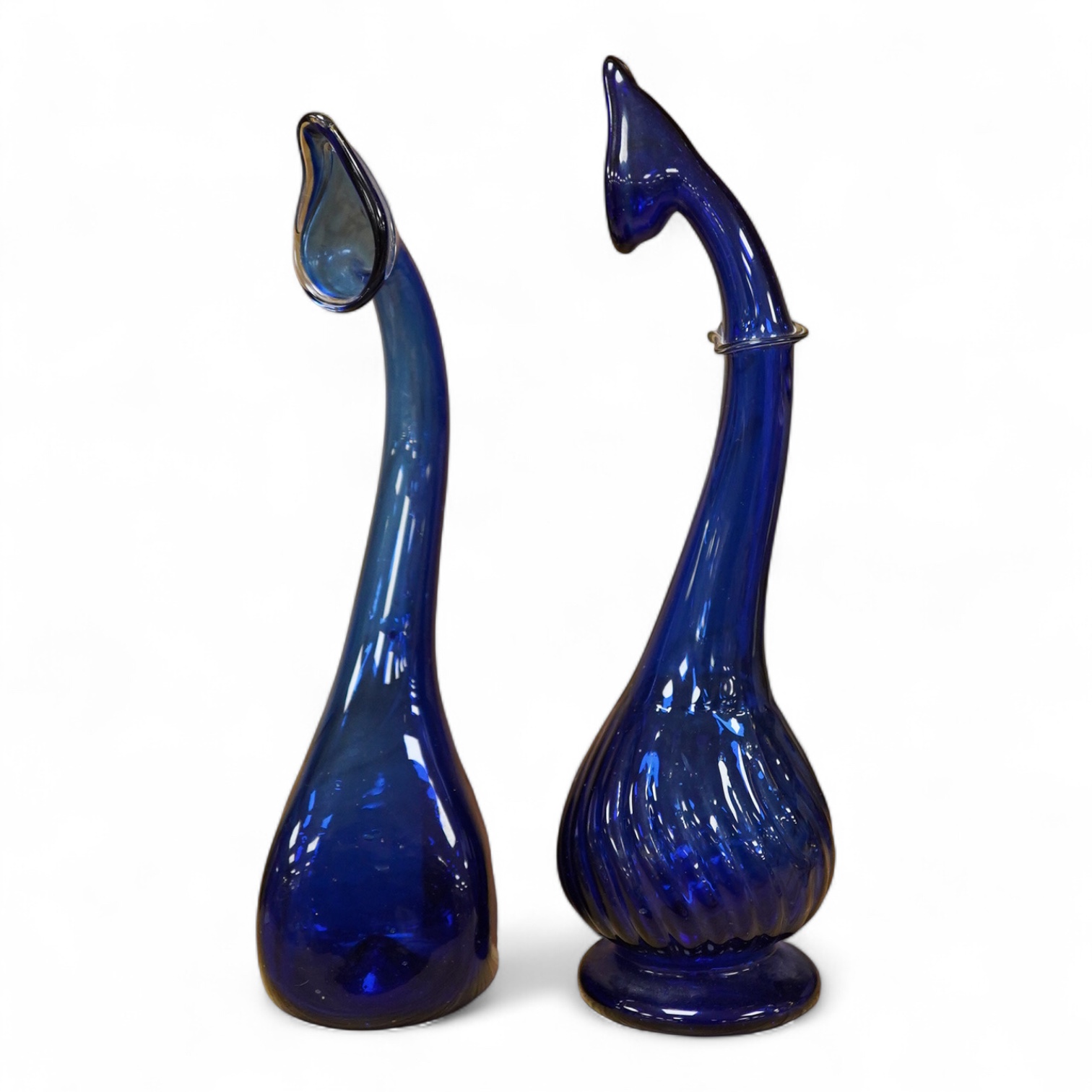 Two Persian blue glass tear catchers, largest 24cm high